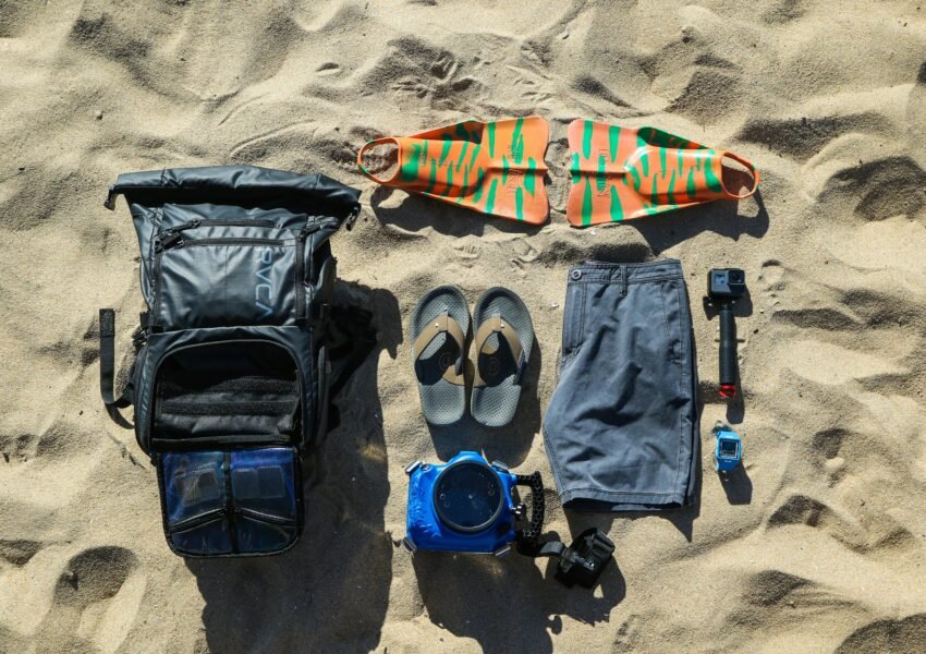 Flat-lay of travel essentials packed for a European backpacking trip