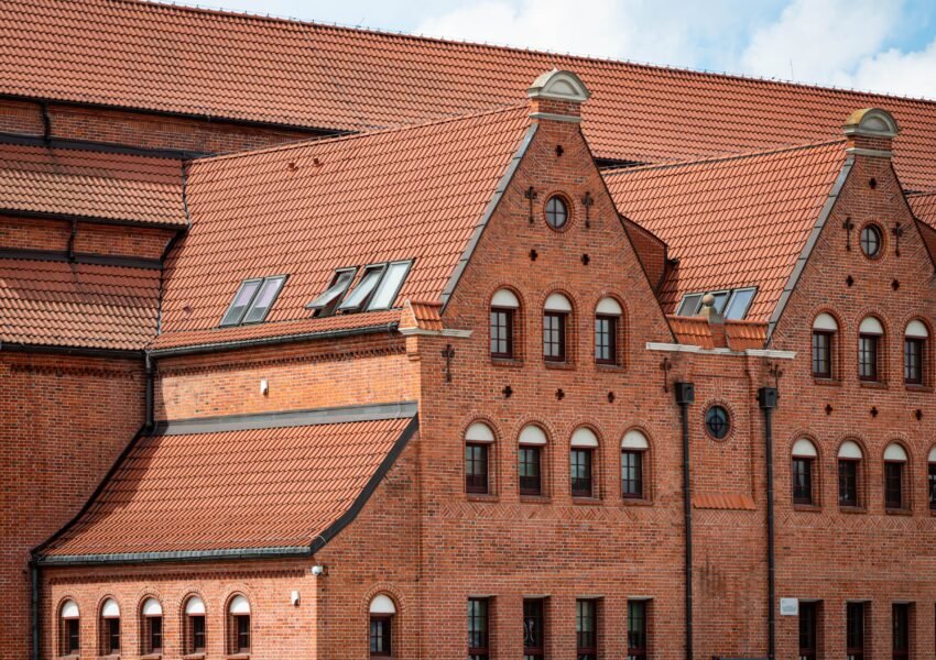 Red brick Gothic facade of a historic building in Gdańsk, Poland