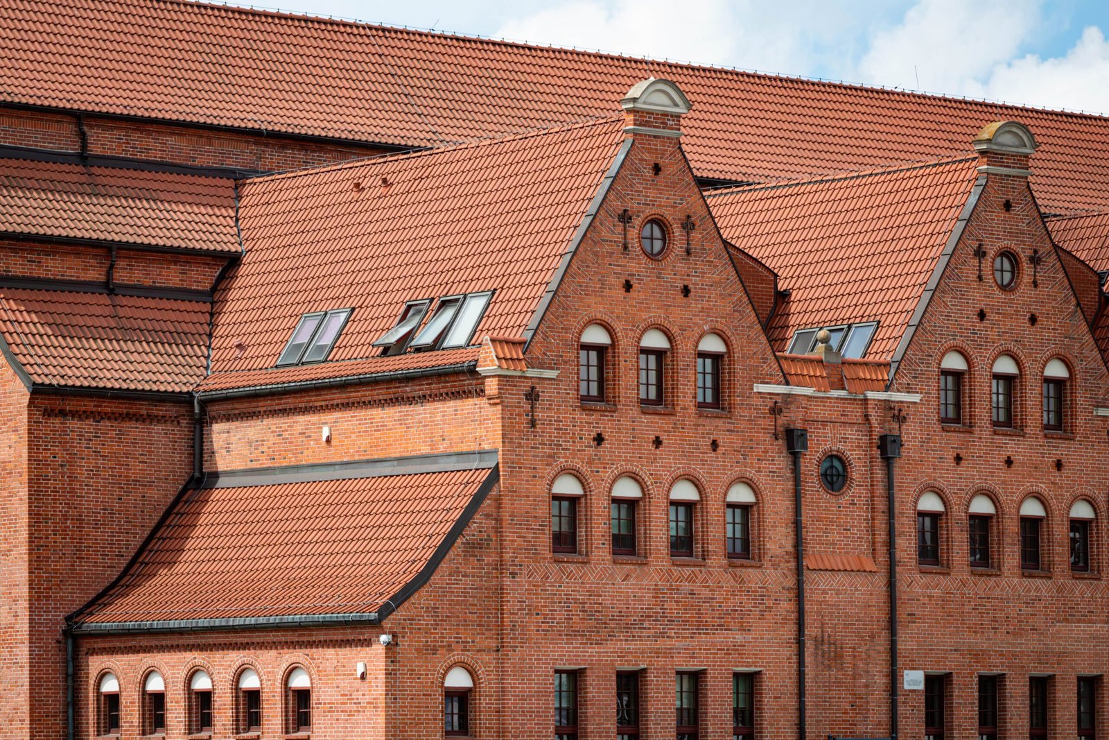 Red brick Gothic facade of a historic building in Gdańsk, Poland