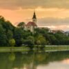 A church and colorful sky over Maribor, Slovenia at sunset