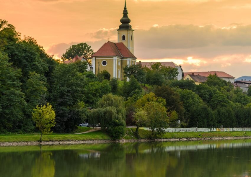 A church and colorful sky over Maribor, Slovenia at sunset